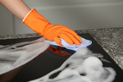 Local technician treating stains on a sofa in SE19