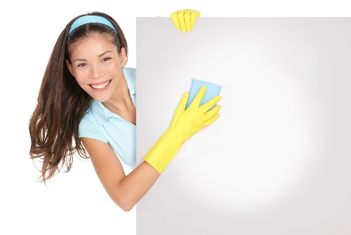 Local cleaning team handling dust removal in a SE19 flat